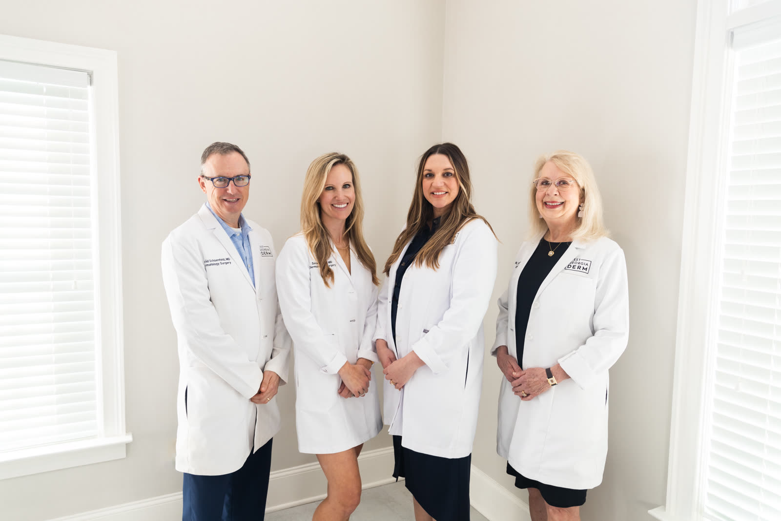 Dr. David Schoenfeld, Dr. Sarah Wilson, Dr. Katie Wadlington, and Dr. Rhonda Rogers in white coats