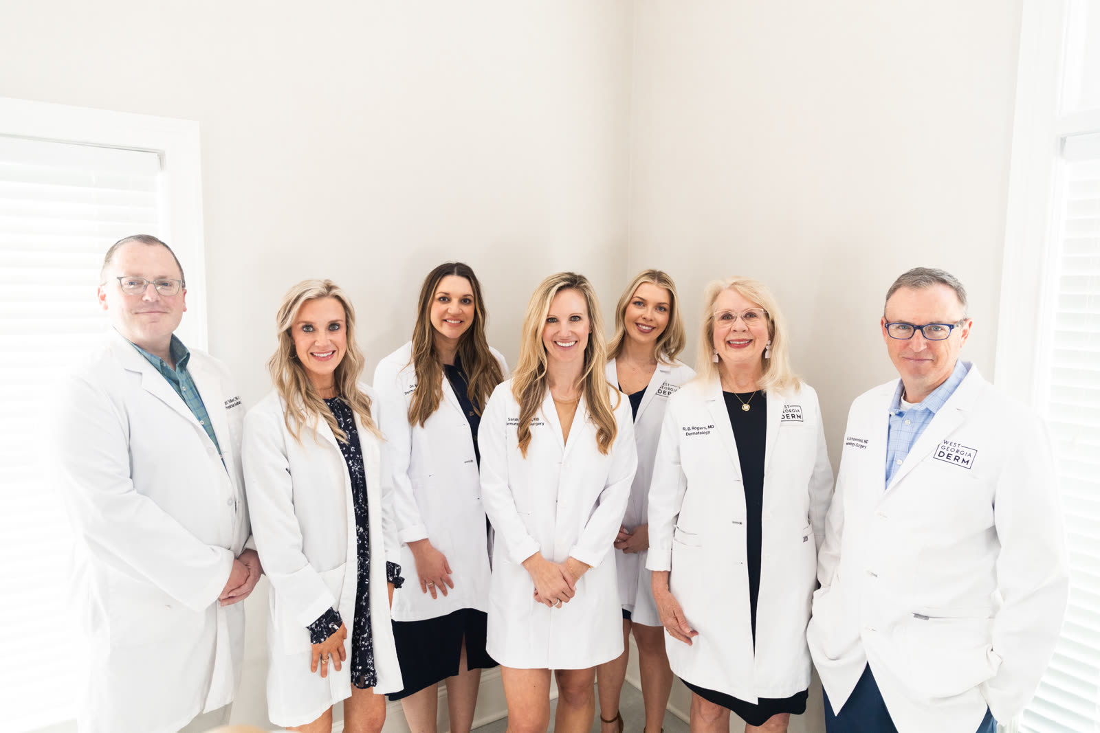 The West Georgia Dermatology physicians and physician assistants in white coats, including Dr. Katie Wadlington and Dr. Sarah Wilson